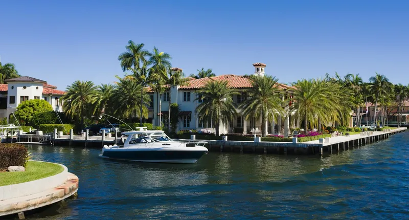 Waterfront homes and a boat on a canal in Fort Lauderdale, Florida